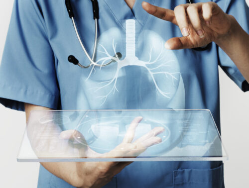 Doctors using transparent tablet with hologram medical technolog